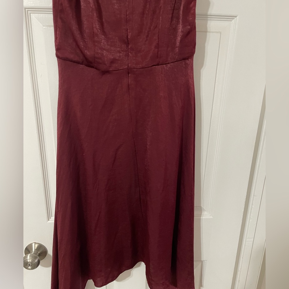 Burgundy ruffle sleeve cocktail dress. Flattering piece to any closet.